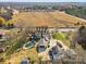 Aerial view showing house, pool, detached garage, and large lot at 8478 Rocky River Rd, Harrisburg, NC 28075