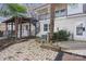 Backyard with spiral staircase and brick patio at 8478 Rocky River Rd, Harrisburg, NC 28075