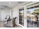 Relaxing balcony with wicker chairs and French doors at 8478 Rocky River Rd, Harrisburg, NC 28075