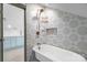 Charming bathroom with clawfoot tub and patterned tile at 8478 Rocky River Rd, Harrisburg, NC 28075