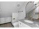 Modern bathroom with granite countertop, white vanity, and decorative mirror at 8478 Rocky River Rd, Harrisburg, NC 28075