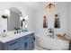 Elegant bathroom featuring a freestanding soaking tub and modern vanity at 8478 Rocky River Rd, Harrisburg, NC 28075