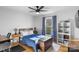 Spacious bedroom with a plush bed, plenty of natural light and built-in shelving at 8478 Rocky River Rd, Harrisburg, NC 28075