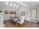 Elegant dining room with hardwood floors, a chandelier, and skylights at 8478 Rocky River Rd, Harrisburg, NC 28075