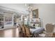 Spacious dining room features built-in shelving, hardwood floors, and a fireplace at 8478 Rocky River Rd, Harrisburg, NC 28075