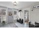 Bright entryway with bench, whitewashed brick, and lots of natural light at 8478 Rocky River Rd, Harrisburg, NC 28075