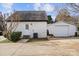 Detached garage with white metal siding at 8478 Rocky River Rd, Harrisburg, NC 28075