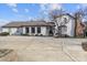 Ranch style home with white brick exterior at 8478 Rocky River Rd, Harrisburg, NC 28075