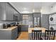 Modern kitchen with gray cabinets, stainless steel appliances, and a butcher block island at 8478 Rocky River Rd, Harrisburg, NC 28075