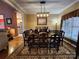 Formal dining room with hardwood floors and large windows at 901 Huntington Hills Dr, Lincolnton, NC 28092