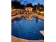 Night view of the inviting swimming pool and pergola at 901 Huntington Hills Dr, Lincolnton, NC 28092