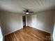 Bedroom with hardwood floors, closet, and ceiling fan at 112 Mccray Ave, Kannapolis, NC 28081