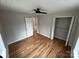 Bedroom with hardwood floors, closet, and entry to hallway at 112 Mccray Ave, Kannapolis, NC 28081