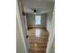 Bright bedroom featuring hardwood floors, a ceiling fan, and a window offering natural light at 112 Mccray Ave, Kannapolis, NC 28081