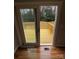 View of the outdoor deck through sliding glass doors, with hardwood floors at 112 Mccray Ave, Kannapolis, NC 28081