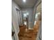 Hallway featuring hardwood floors, neutral paint, and access to kitchen and other rooms at 112 Mccray Ave, Kannapolis, NC 28081