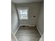 Laundry room featuring tiled floors, neutral paint, and a window at 112 Mccray Ave, Kannapolis, NC 28081