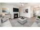 Living room with fireplace, hardwood floors, and large windows at 1218 Raelea Dr, Indian Trail, NC 28079