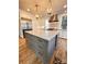 Modern kitchen with large island and gray cabinets at 13612 Robert Walker Dr, Davidson, NC 28036