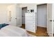 Well-lit bedroom closet with ample storage space and built-in shelving at 2610 Tattersall Dr, Charlotte, NC 28210