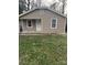 Charming single-story home with tan siding, a front lawn, and a welcoming front door at 309 W Ruby W Ave, Gastonia, NC 28052