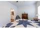 Bedroom with blue and white star quilt, wooden dresser, and view of bathroom at 112 Canina Ln, Indian Trail, NC 28079