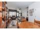 Open concept dining area with wooden table and chairs, adjacent to living room at 112 Canina Ln, Indian Trail, NC 28079