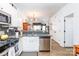 Open concept kitchen with island, stainless steel appliances, and granite countertops at 112 Canina Ln, Indian Trail, NC 28079