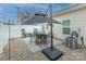 Relaxing patio area with seating, umbrella, and gravel at 112 Canina Ln, Indian Trail, NC 28079