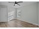 Bedroom with ceiling fan, double-door closet, and access to a bathroom at 116 E Maryland Ave, Bessemer City, NC 28016