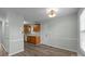 Bright dining area with kitchen access and hardwood floor at 116 E Maryland Ave, Bessemer City, NC 28016