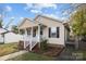 Tan house with small front porch and yard at 116 E Maryland Ave, Bessemer City, NC 28016