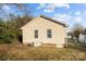 Tan house with back patio and yard at 116 E Maryland Ave, Bessemer City, NC 28016