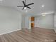 Open living room with hardwood floors and kitchen access at 116 E Maryland Ave, Bessemer City, NC 28016