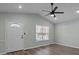 Living room with hardwood floors, door and window at 116 E Maryland Ave, Bessemer City, NC 28016