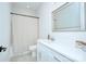 Clean bathroom with white vanity and large mirror at 1220 Lomax Ave, Charlotte, NC 28211