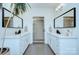 Double vanity bathroom with modern fixtures and mirrors at 1220 Lomax Ave, Charlotte, NC 28211