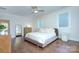 Comfortable bedroom with hardwood floors and ceiling fan at 1220 Lomax Ave, Charlotte, NC 28211