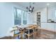 Elegant dining area with hardwood floors and a modern light fixture at 1220 Lomax Ave, Charlotte, NC 28211