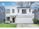 Modern two-story house with white exterior and two-car garage at 1220 Lomax Ave, Charlotte, NC 28211