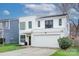 Modern two-story house with white exterior and two-car garage at 1220 Lomax Ave, Charlotte, NC 28211