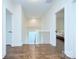 Bright hallway with hardwood floors and access to bedrooms at 1220 Lomax Ave, Charlotte, NC 28211