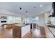 Modern kitchen with large island and stainless steel appliances at 1220 Lomax Ave, Charlotte, NC 28211