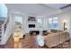 Bright living room with fireplace, hardwood floors, and modern furniture at 1220 Lomax Ave, Charlotte, NC 28211