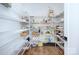 Well-organized pantry with ample shelving for storage at 1220 Lomax Ave, Charlotte, NC 28211