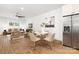 Dining area with a round table and chairs, adjacent to the kitchen and living room at 13114 Blacksmith Ct, Matthews, NC 28105