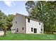 Two-story house with light gray siding, attached garage, and landscaping at 13114 Blacksmith Ct, Matthews, NC 28105