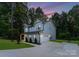 Two-story house with gray siding, attached garage, and a landscaped yard at 13114 Blacksmith Ct, Matthews, NC 28105