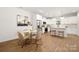 Modern kitchen with white cabinets, marble countertops, and a kitchen island at 13114 Blacksmith Ct, Matthews, NC 28105