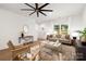 Living room with hardwood floors, stylish furniture, and an entryway view at 13114 Blacksmith Ct, Matthews, NC 28105